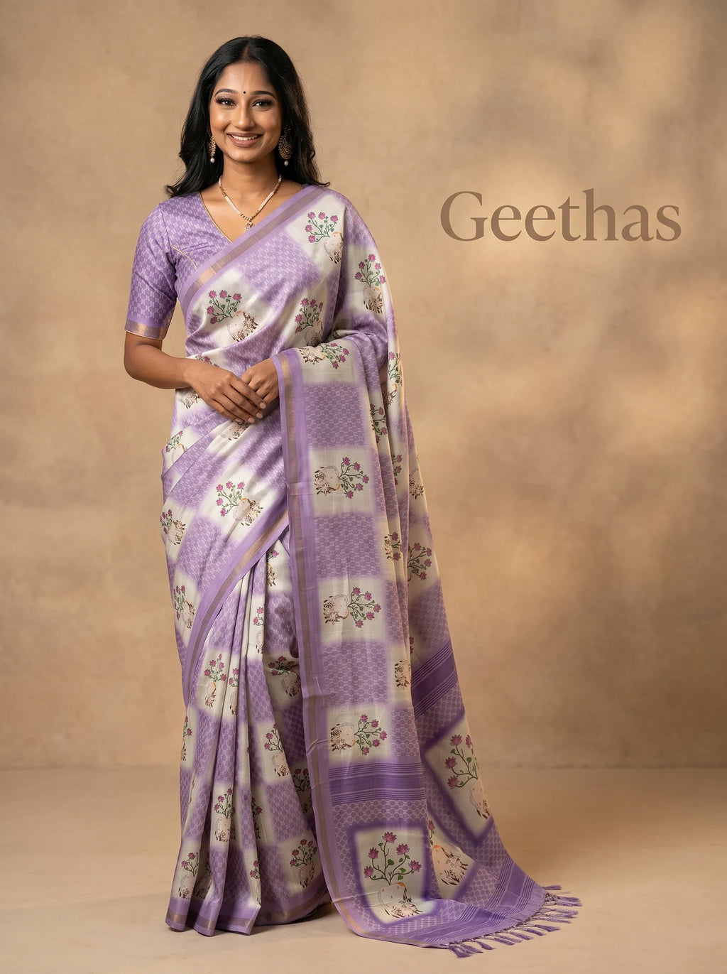 Model wearing a white and violet slub linen saree with floral and cow prints, geometric panels and tassled pallu