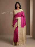 Model wearing fuchsia pink soft silk saree with ivory-gold pallu and decorative woven border